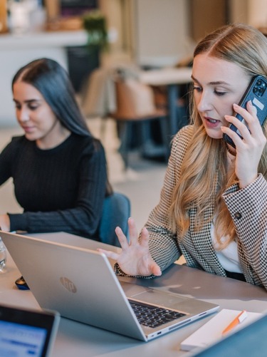 Sharp & Carter Specialist Recruitment, Clients,  Female Consultant Talking on the Phone